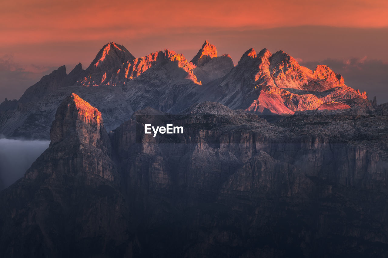 Moody landscape with dolomite mountains in perfect sunset light.