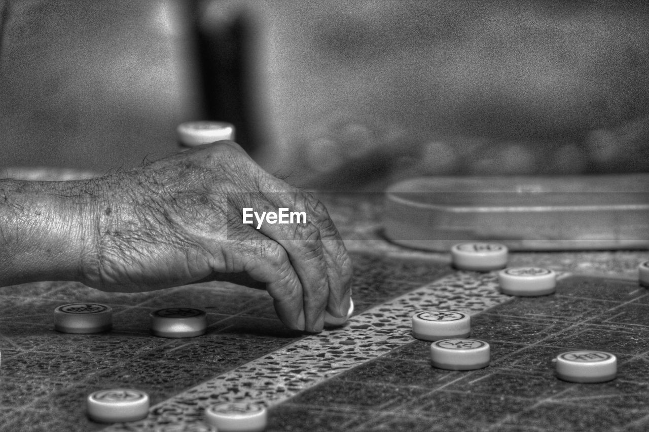 Close-up of hand playing board game