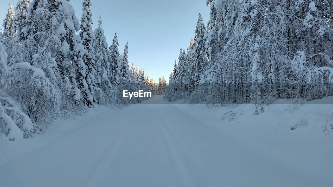 Panoramic view of snow covered mountain against sky