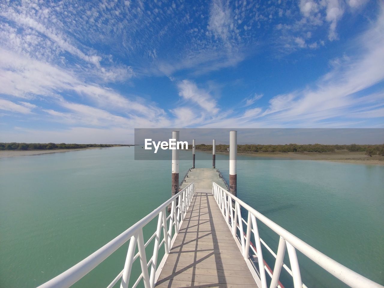 Pier over sea against sky