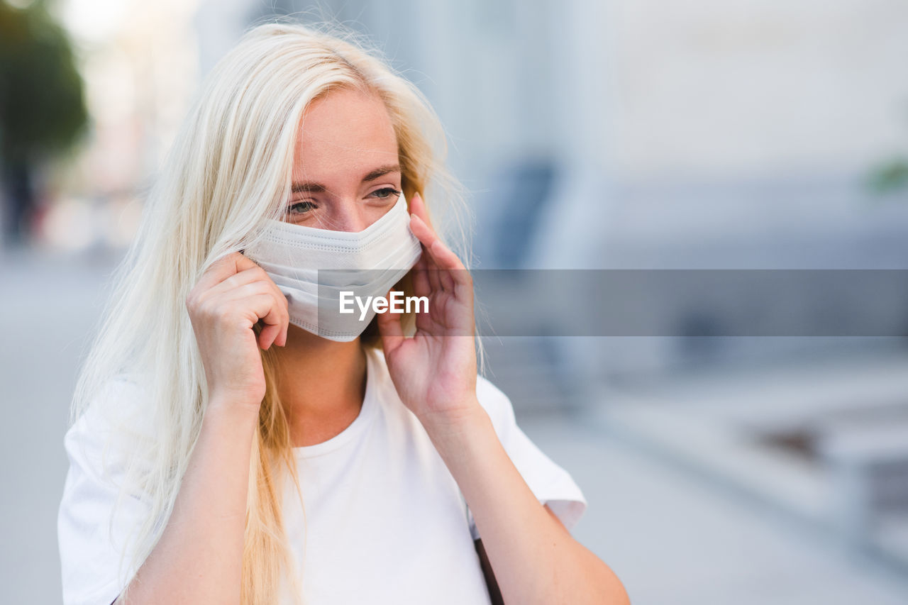 Young woman wearing mask