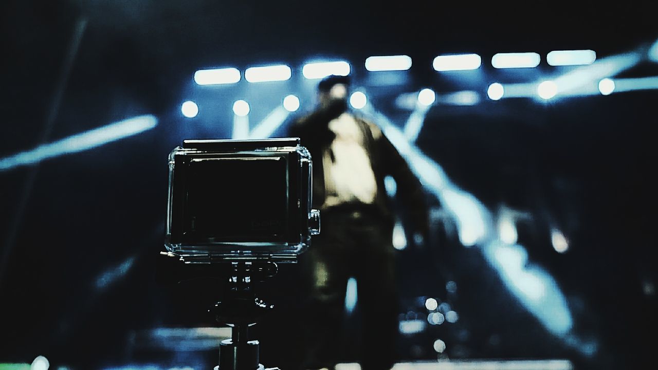 CLOSE-UP OF ILLUMINATED LIGHTING EQUIPMENT IN NIGHTCLUB