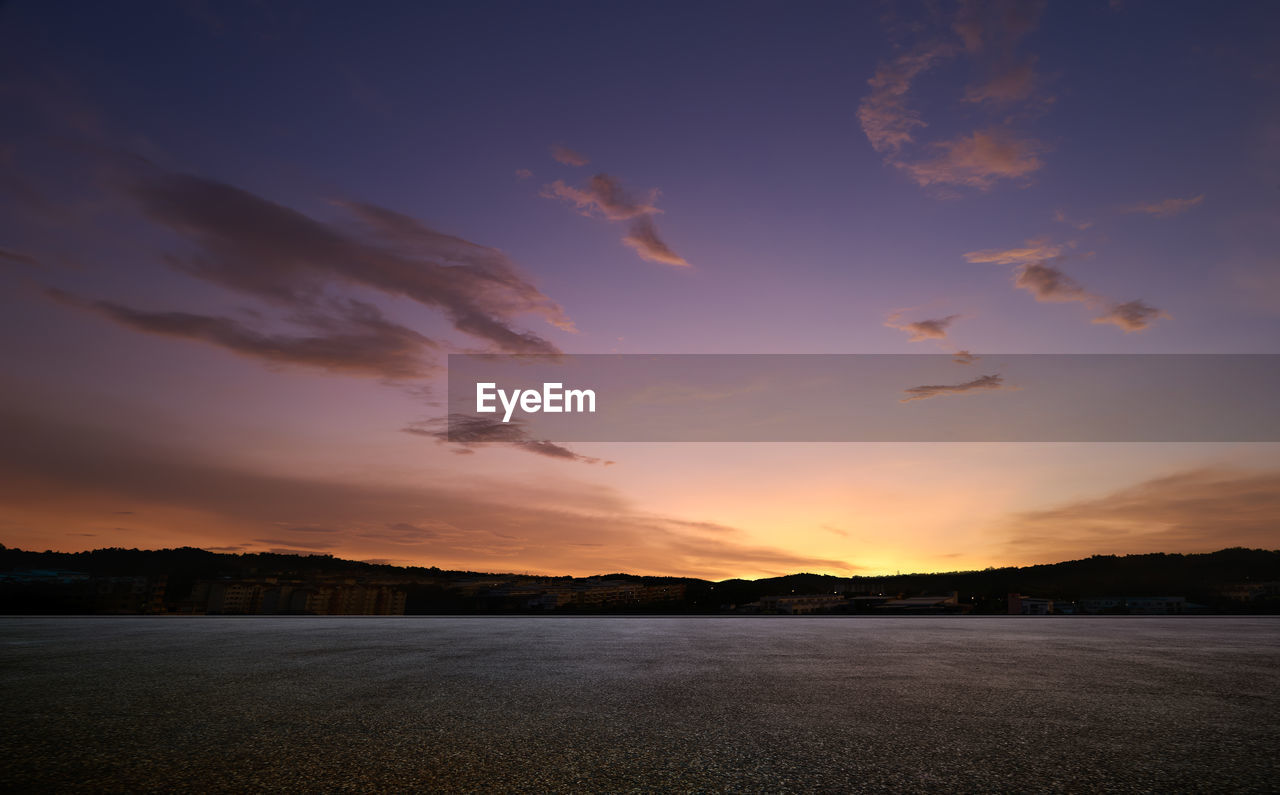 scenic view of sea against orange sky