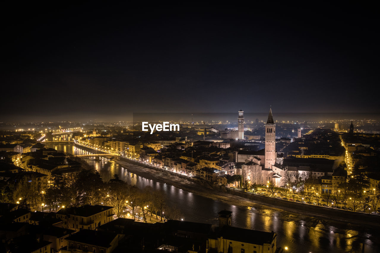 Illuminated buildings in city at night