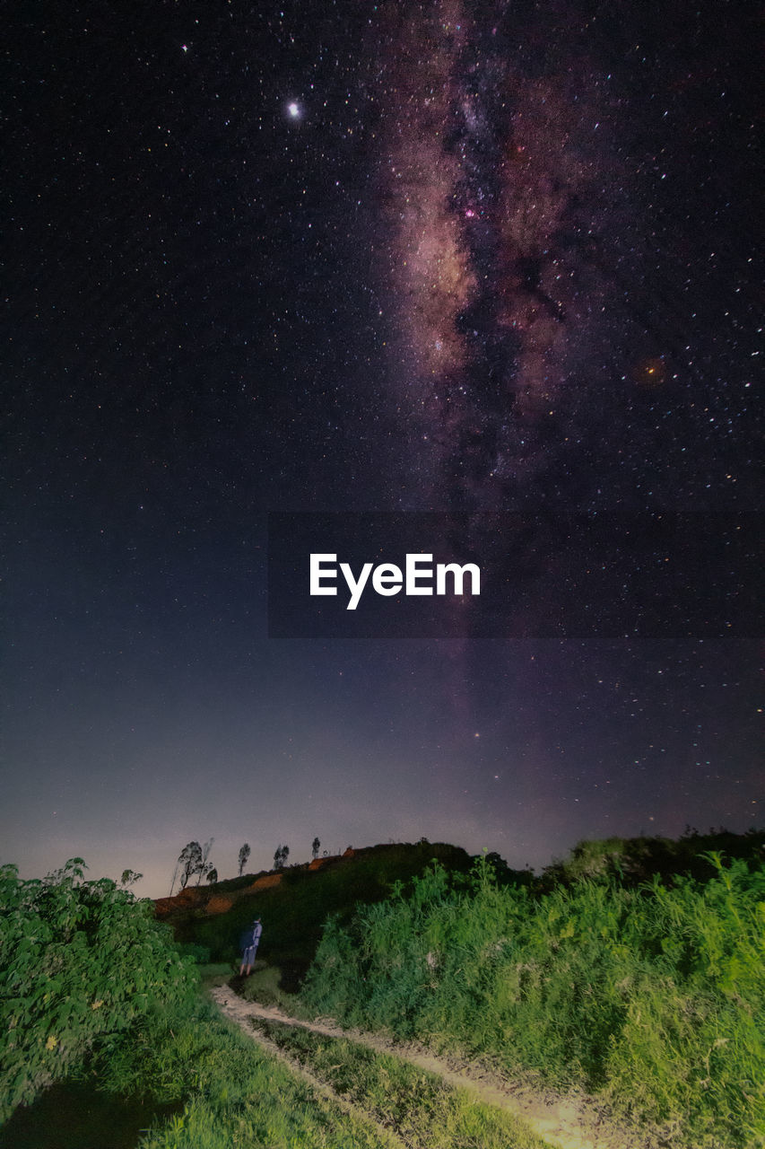 SCENIC VIEW OF LAND AGAINST SKY AT NIGHT