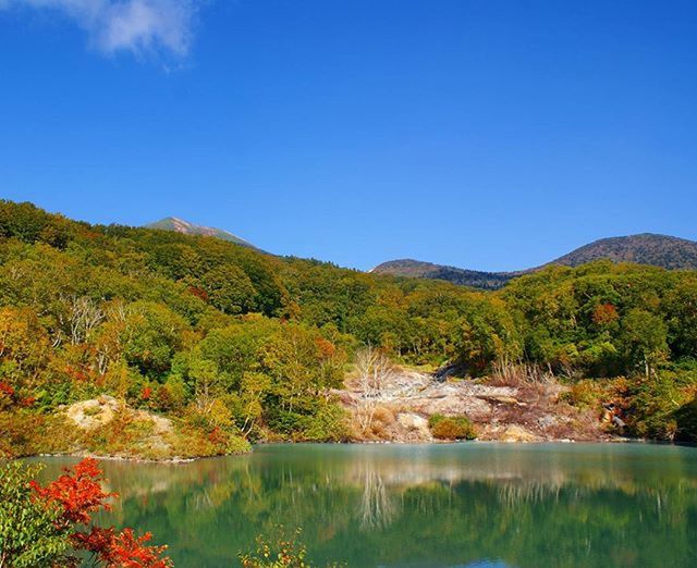 SCENIC VIEW OF LAKE AND MOUNTAINS