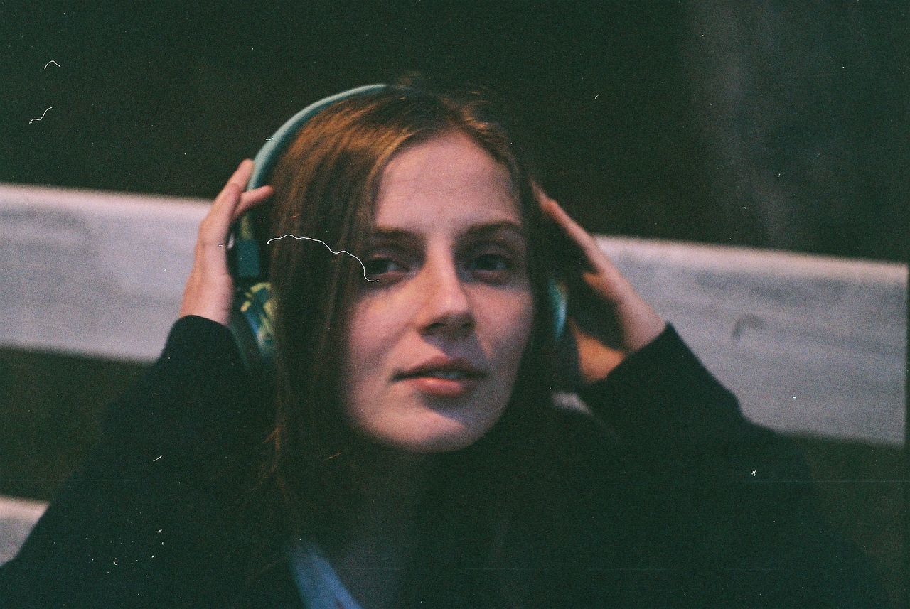 Portrait of young woman wearing headphones