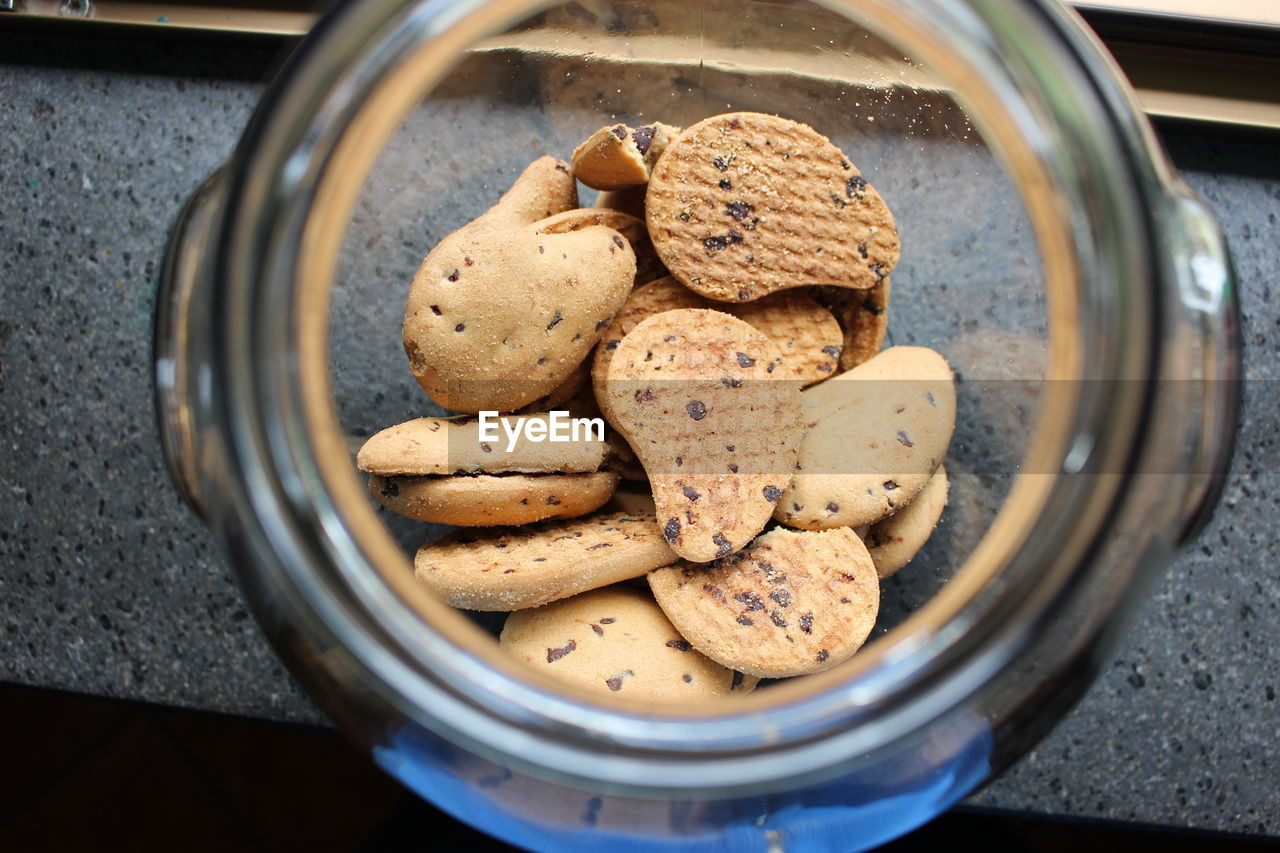 Cookies inside of glass jar on table