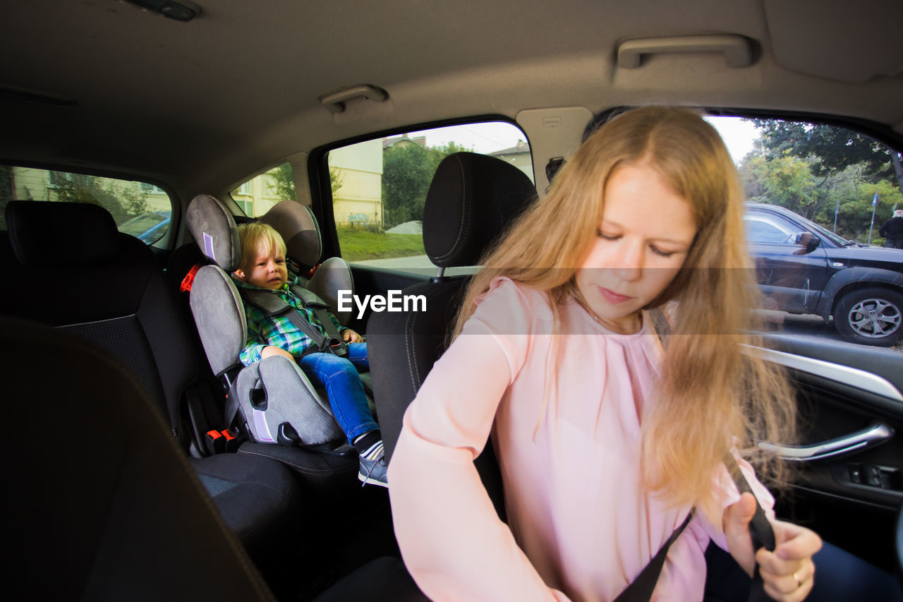 Mother and son in car