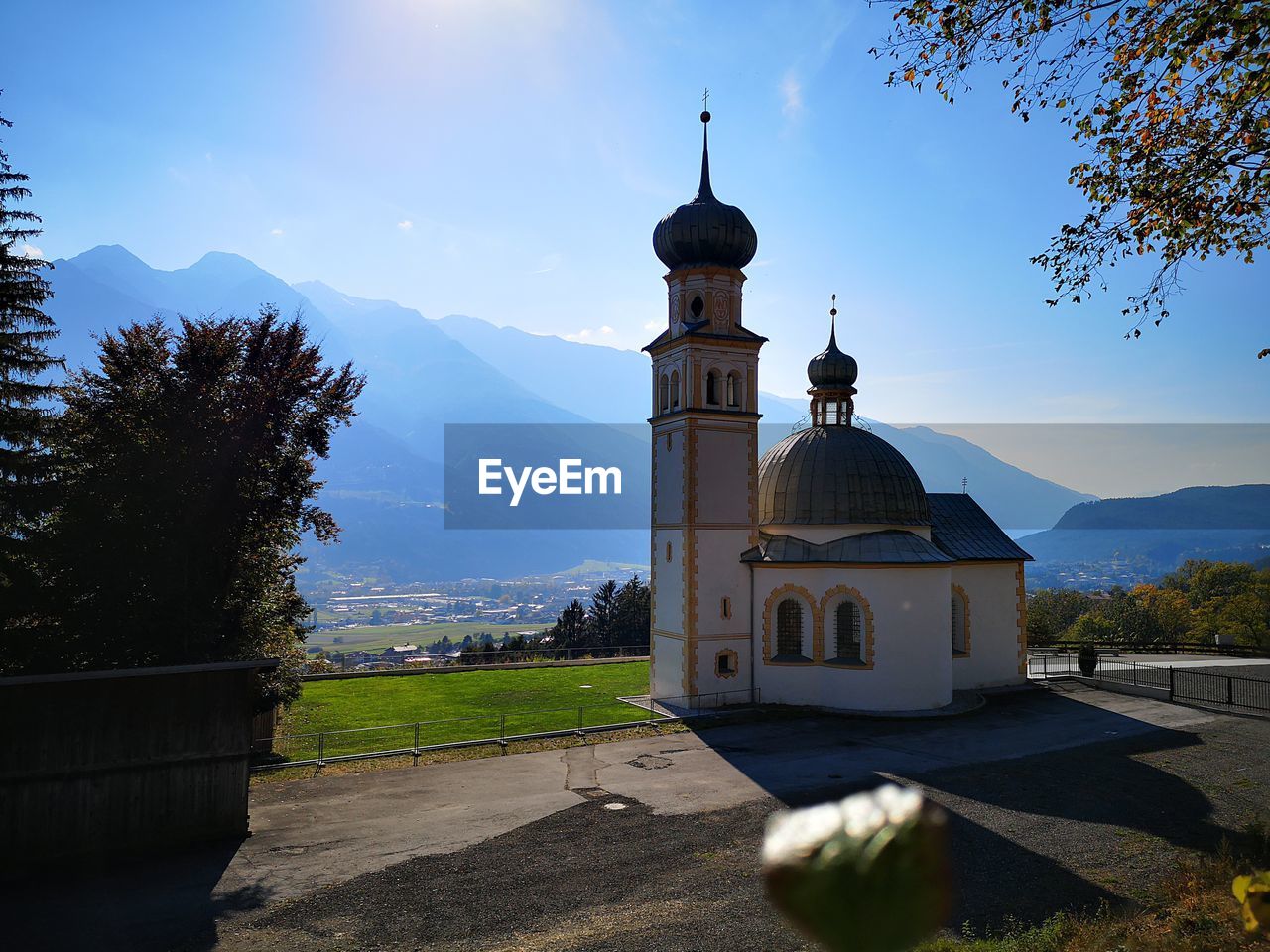 Church by building against sky