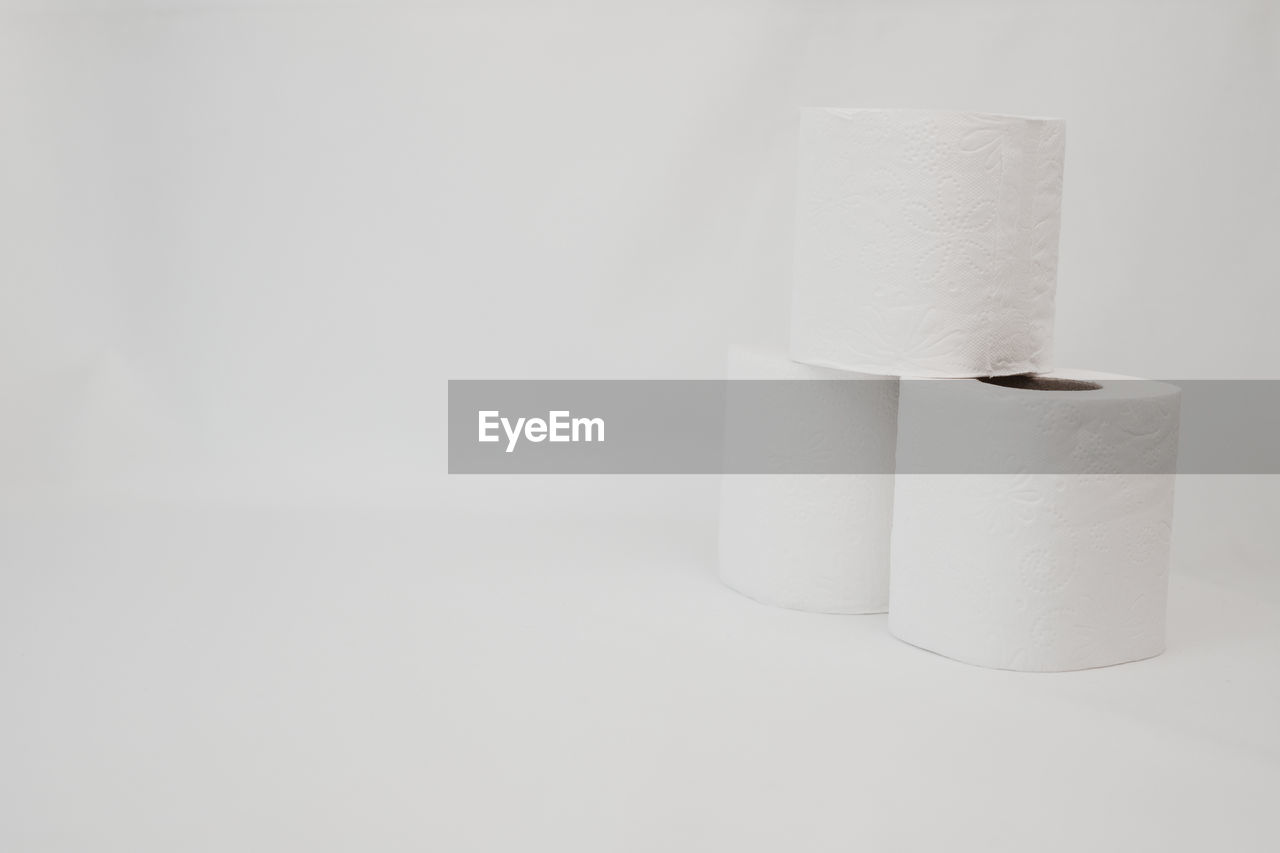 toilet paper, paper towel, cylinder, rolled up, paper, indoors, copy space, white, studio shot, no people, white background, single object, hygiene, simplicity, close-up, cut out