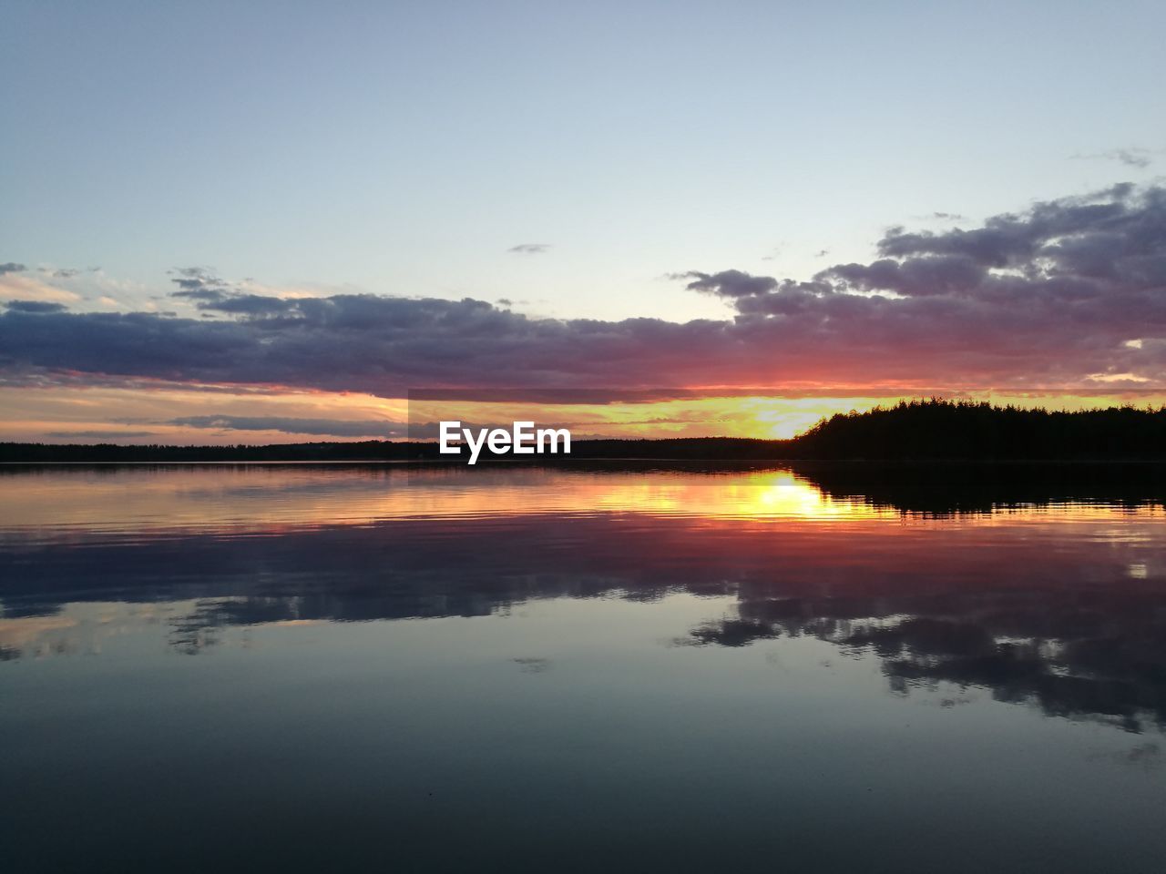 SCENIC VIEW OF LAKE BY SILHOUETTE TREES AGAINST SKY