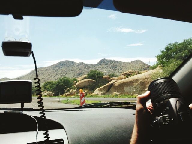 LANDSCAPE SEEN THROUGH TRAIN WINDSHIELD