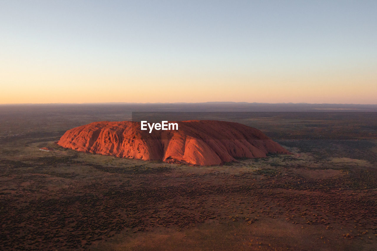 scenic view of landscape against sky during sunset