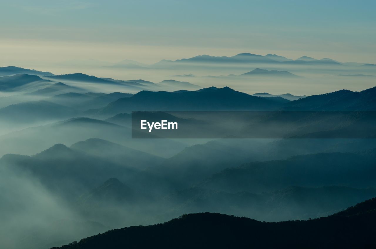 Scenic view of silhouette mountains against sky