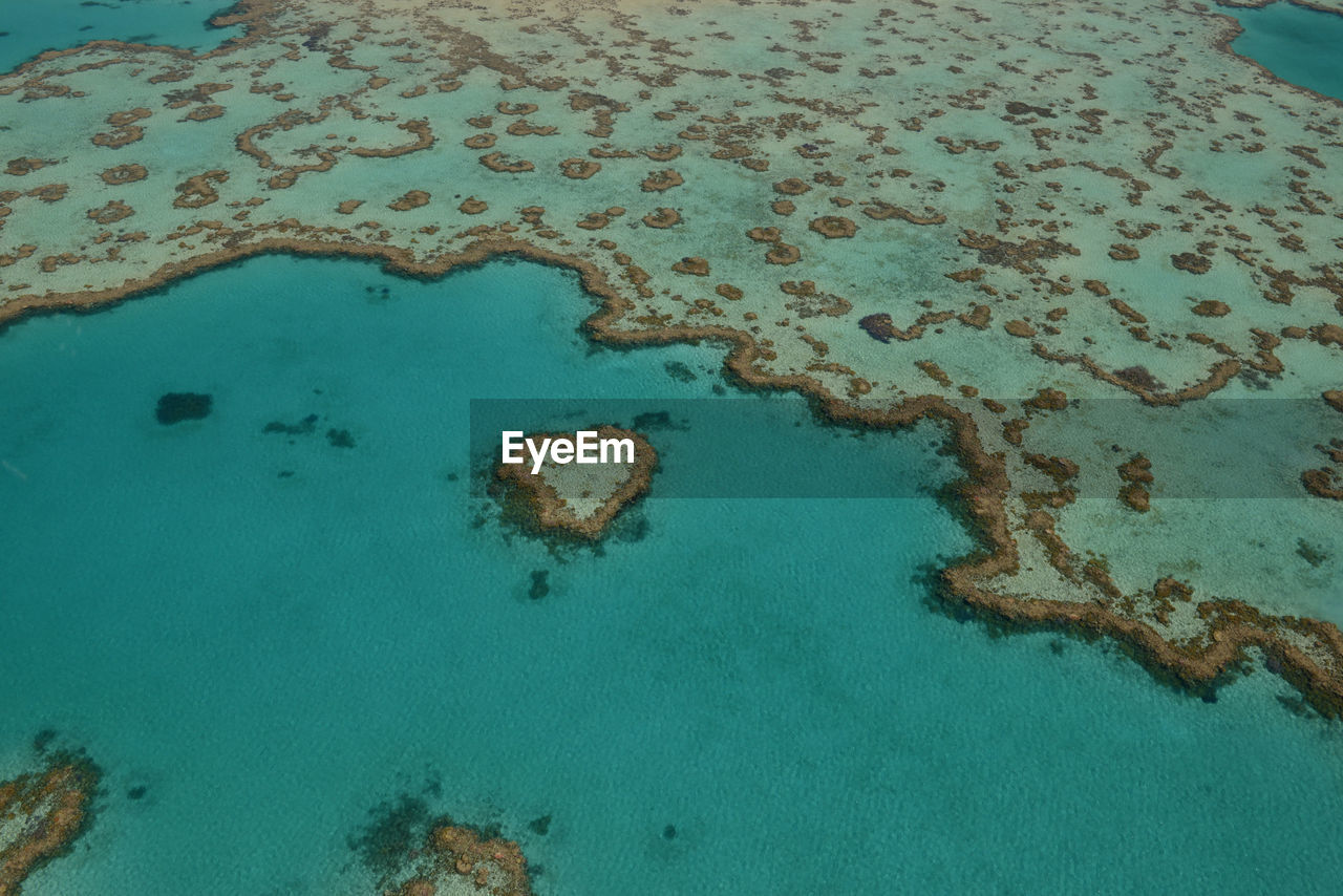 HIGH ANGLE VIEW OF BLUE WATER ON SEA SHORE