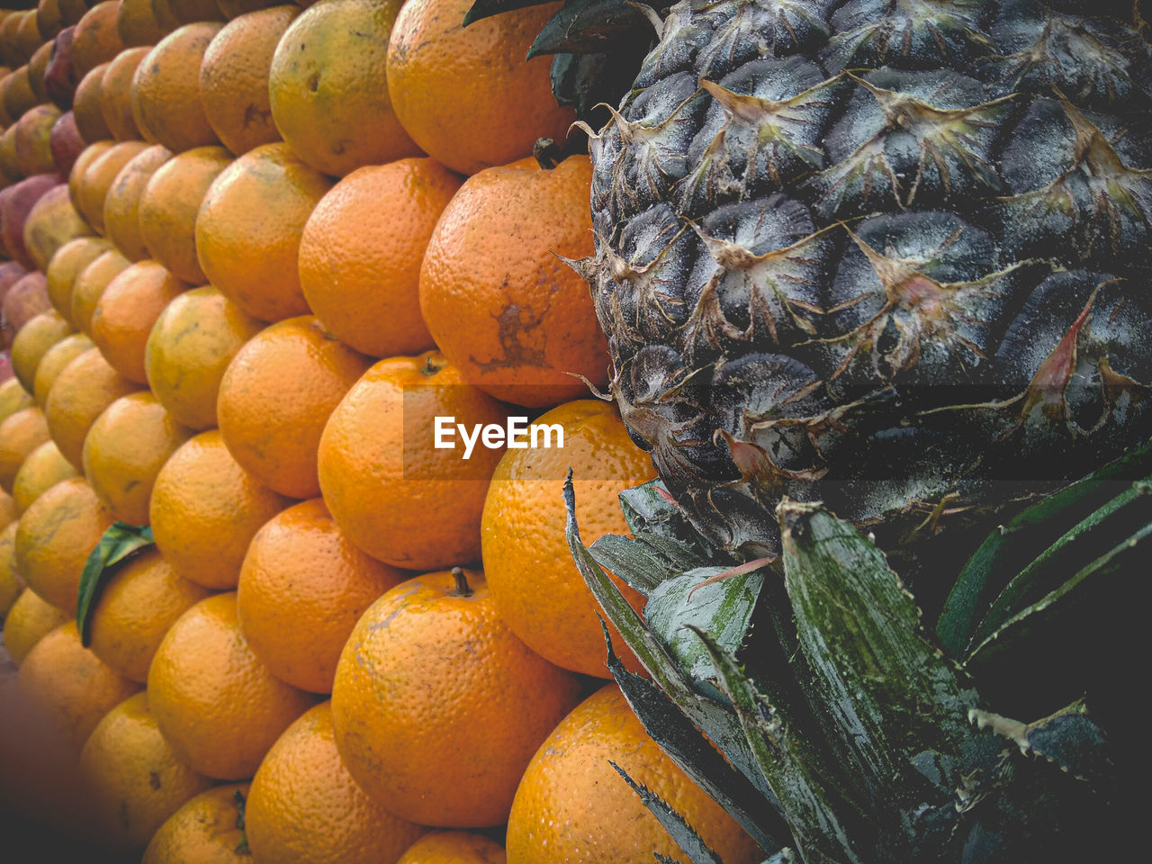 Close-up of orange fruits for sale in market