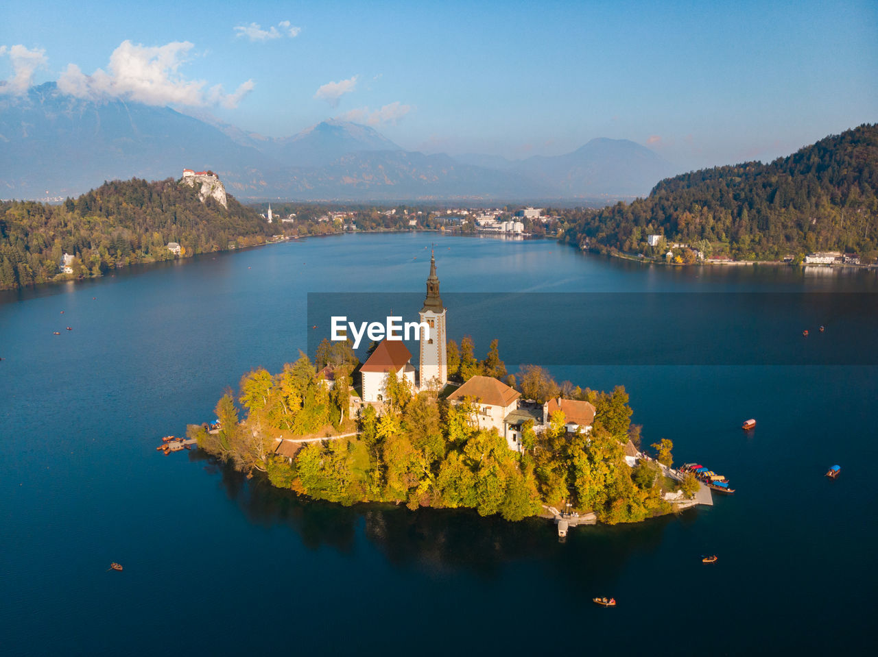 High angle view of lake amidst buildings against sky