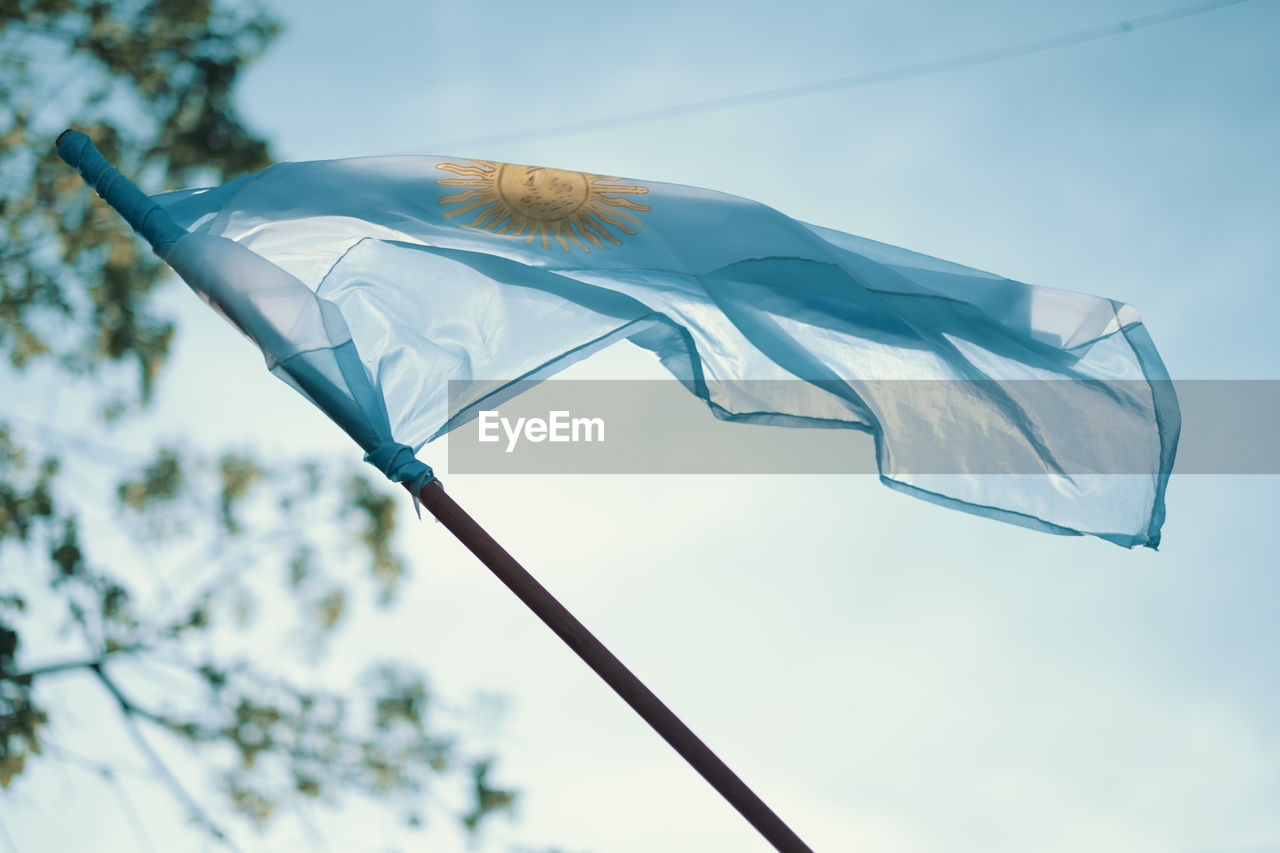 Low angle view of waving argentinian flag