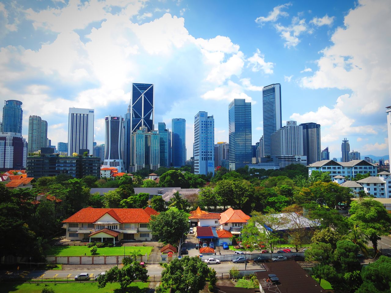 CITYSCAPE AGAINST CLOUDY SKY