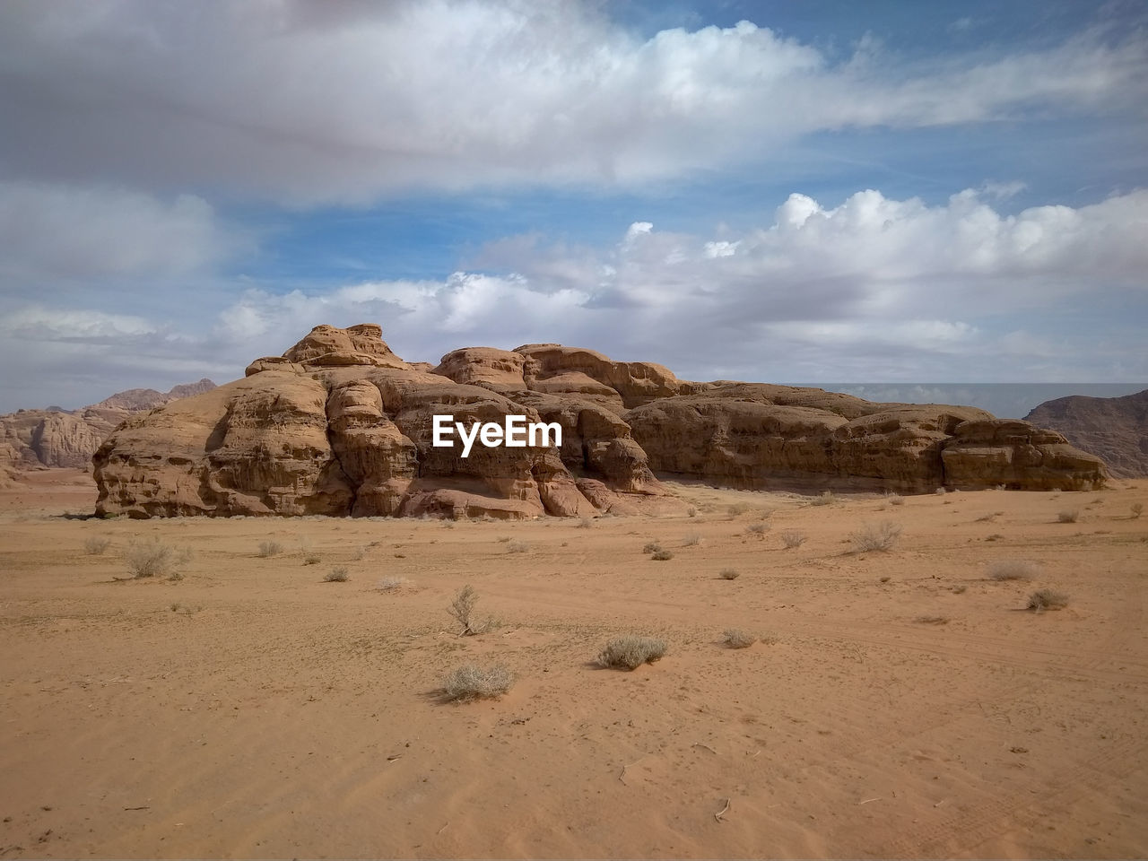 Rock formations on landscape against sky