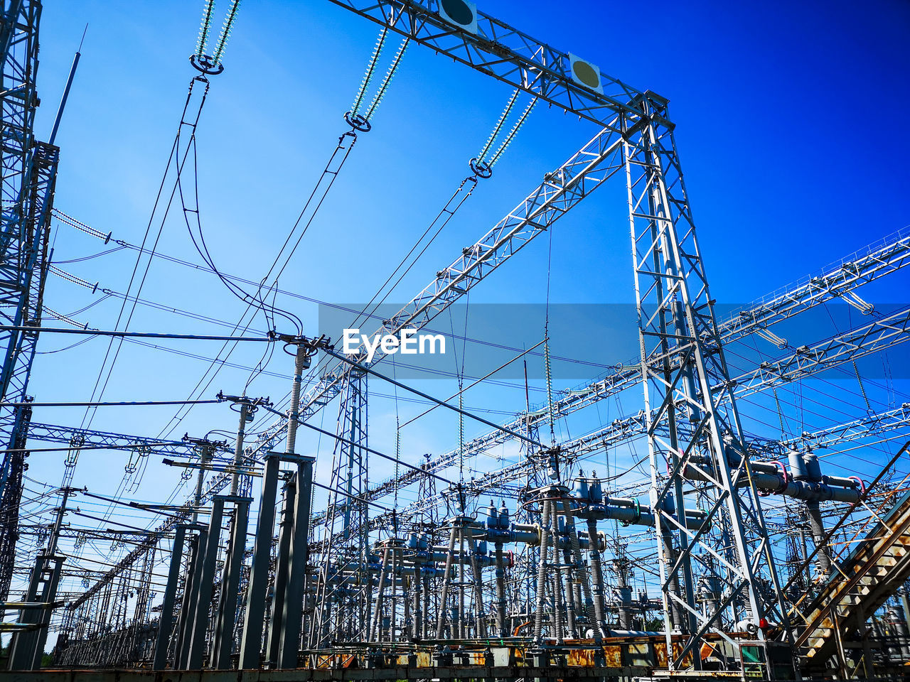Substation against clear blue sky