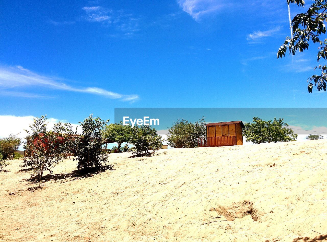 LOW ANGLE VIEW OF BEACH AGAINST SKY