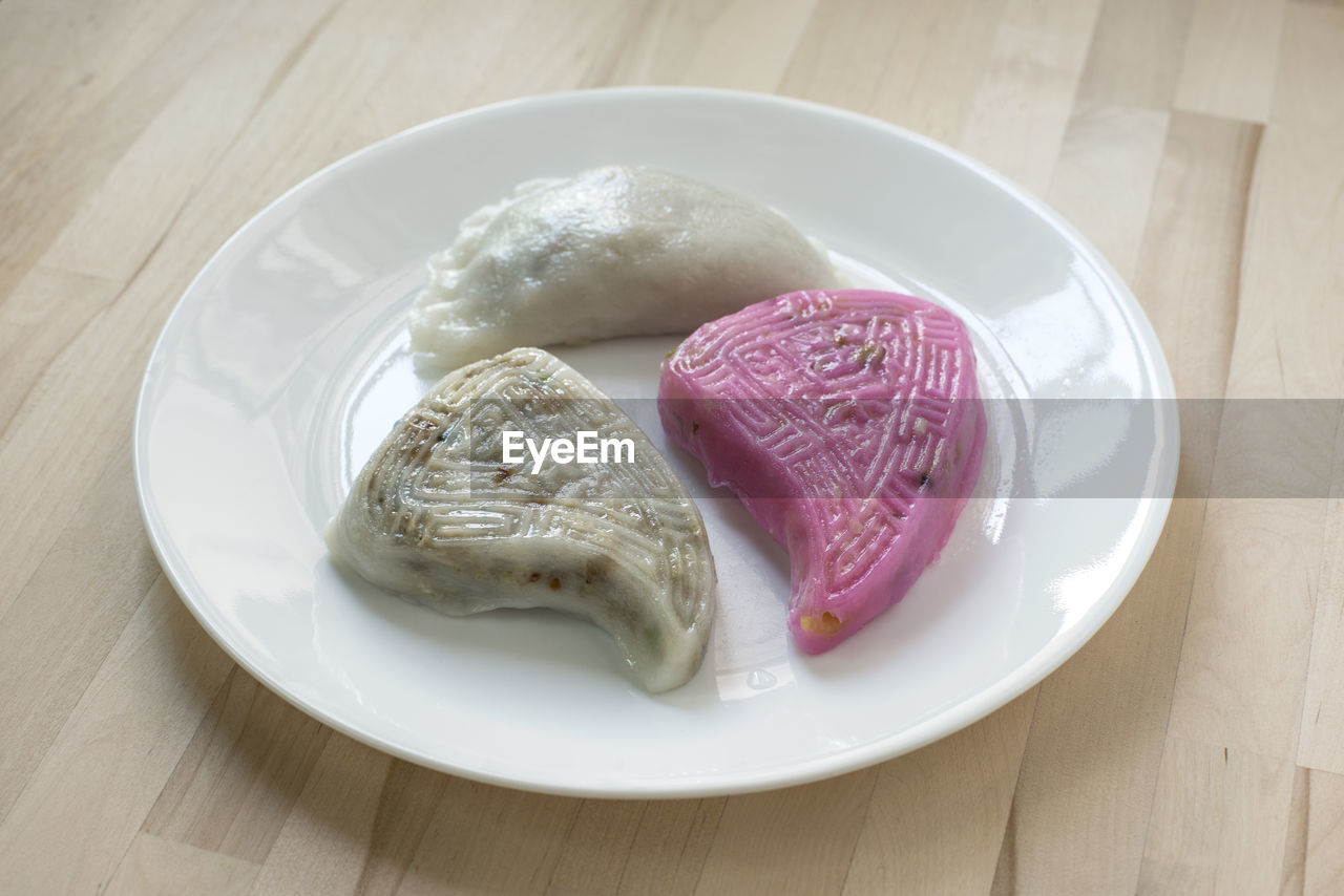 High angle view of fresh kuih served in plate on table