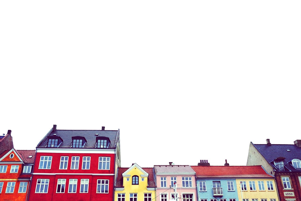 Low angle view of houses against clear sky