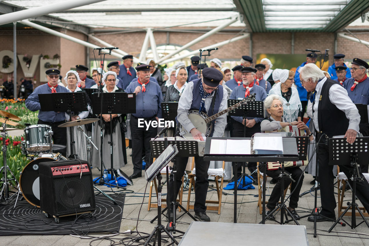 GROUP OF PEOPLE AT MUSIC FESTIVAL