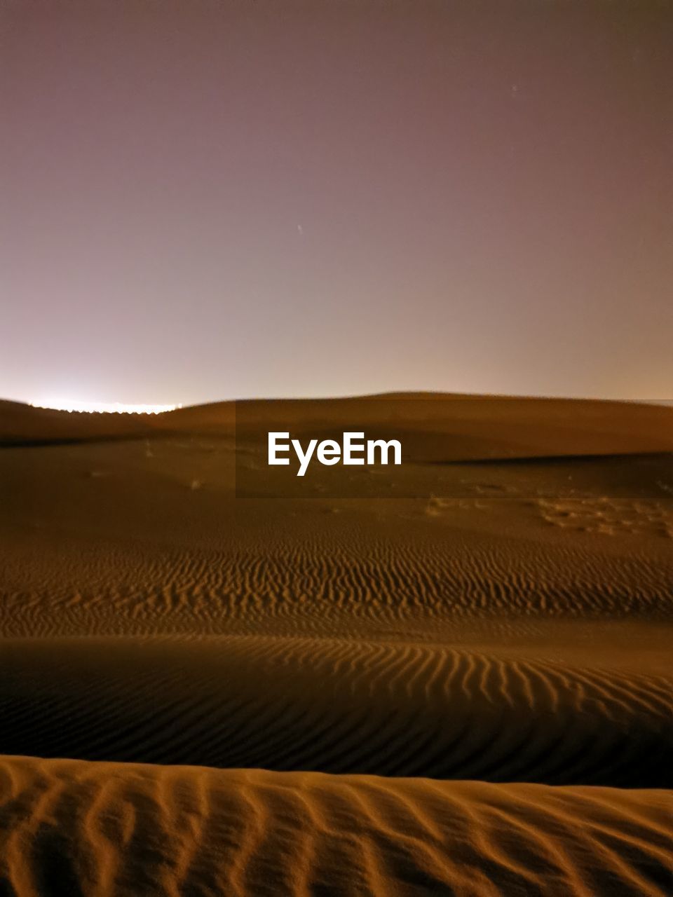 Scenic view of desert against clear sky