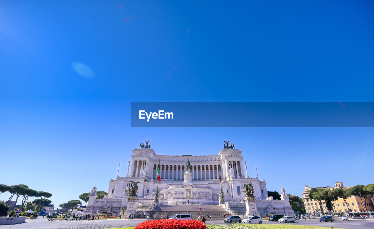 Low angle view of buildings against blue sky