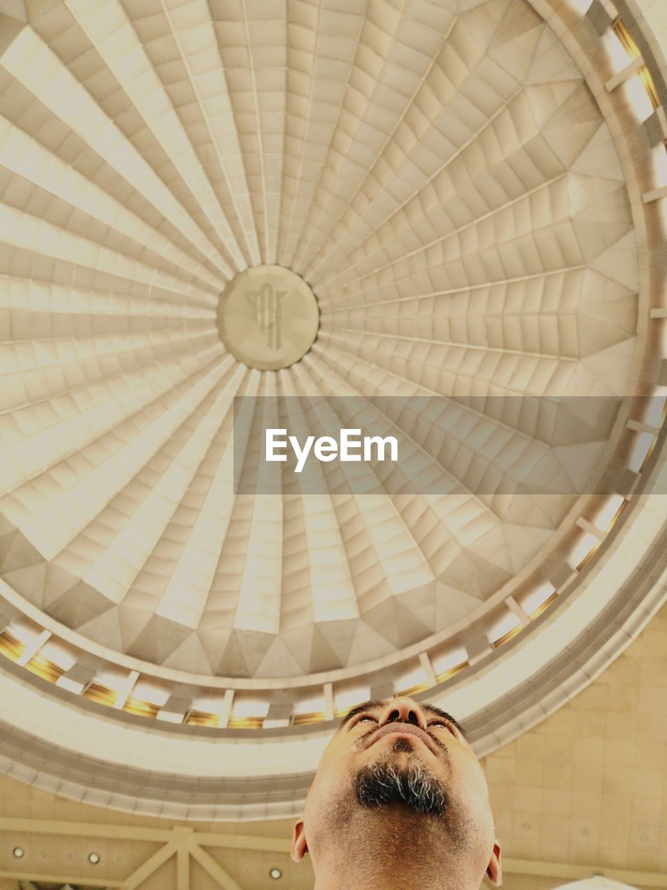 Low angle view of man against ceiling