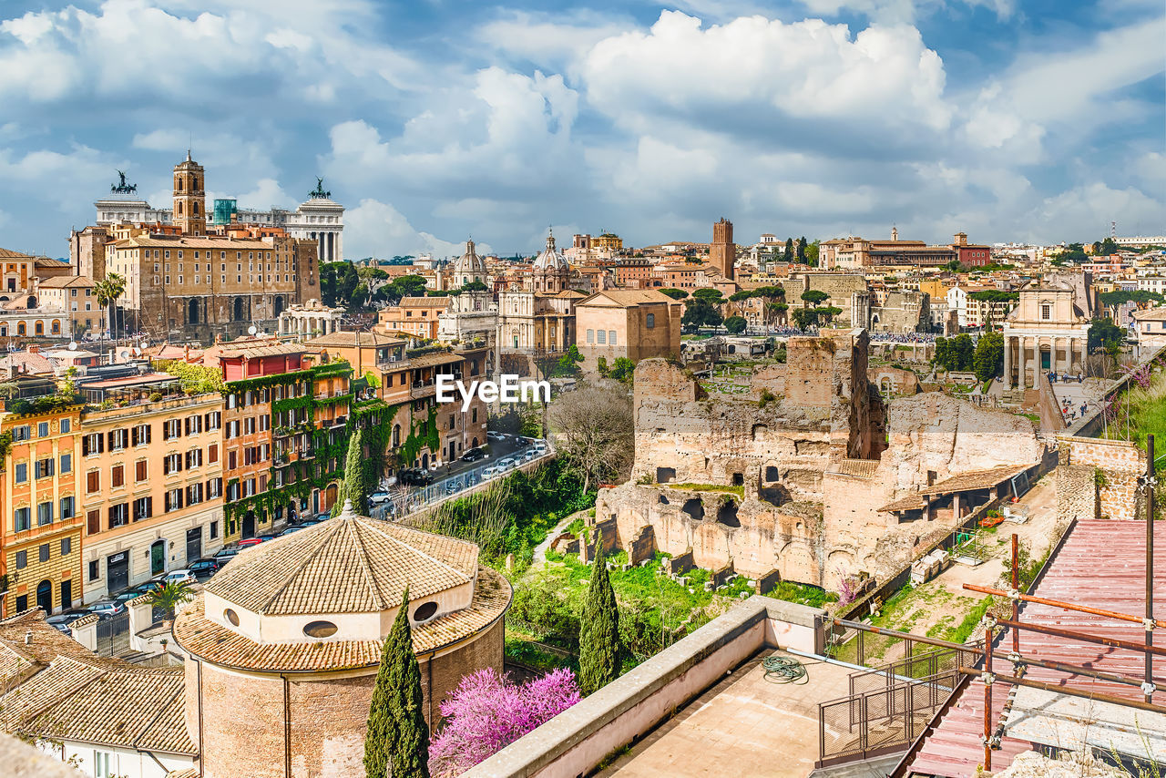 View of roman forum against cloudy sky