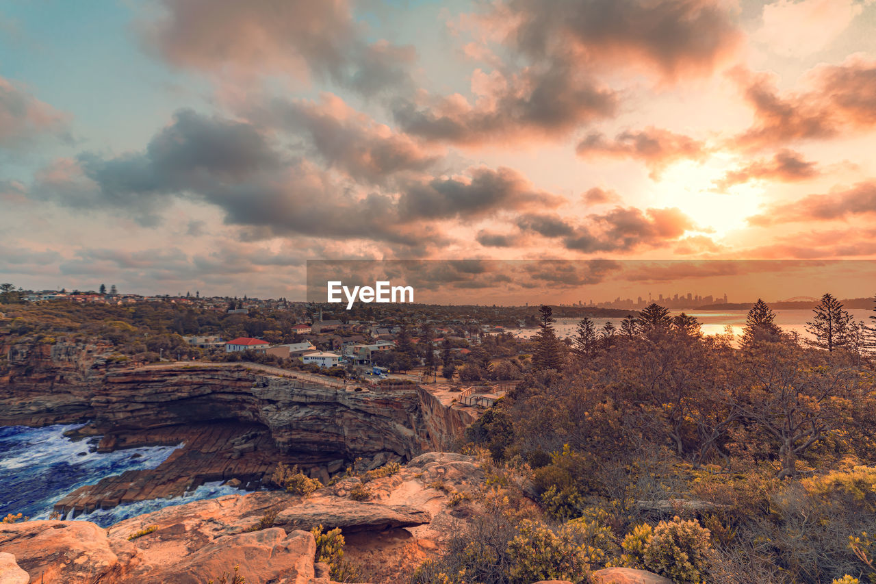 Scenic view of landscape against sky during sunset