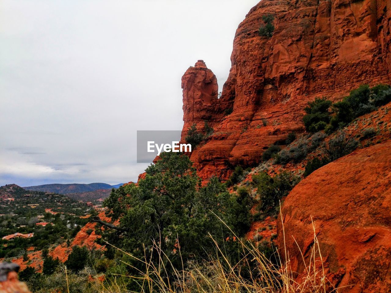 Rock formations on landscape against sky