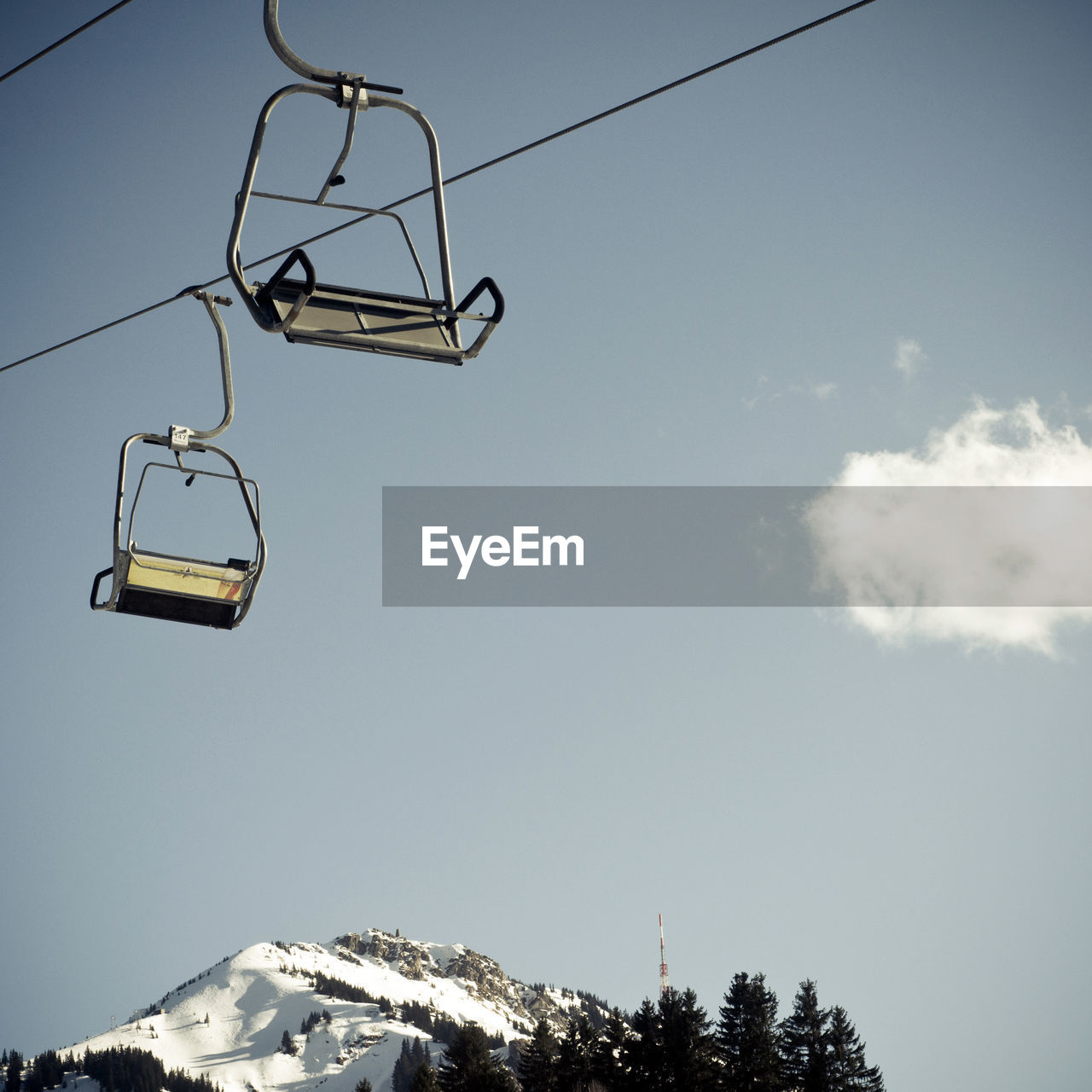 Low angle view of ski lift against sky