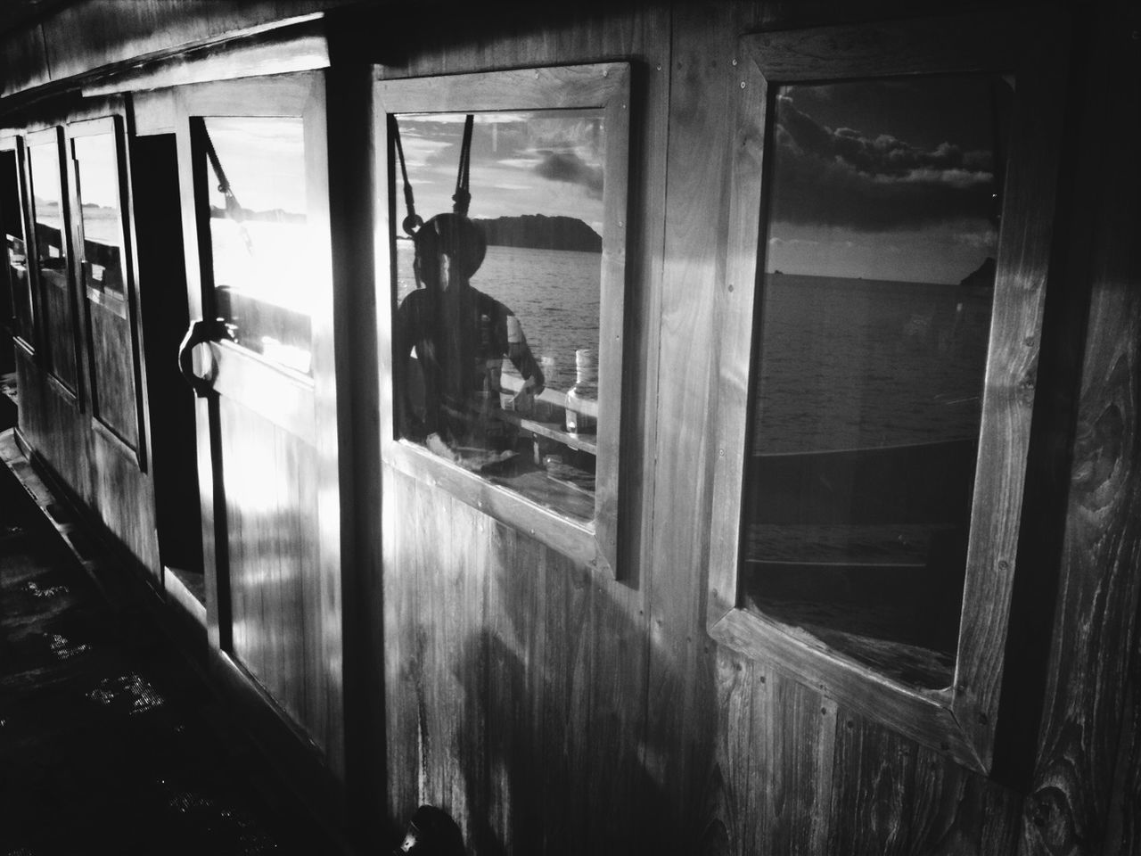 Man reflected on window glass