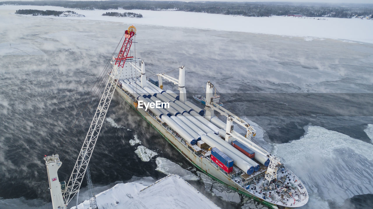 Aerial view of ship in harbor in winter