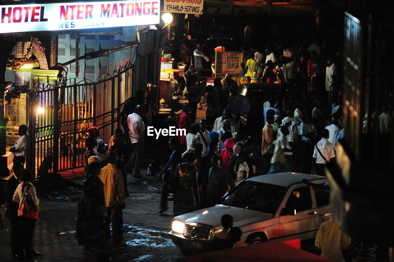 PEOPLE AT NIGHT IN CITY