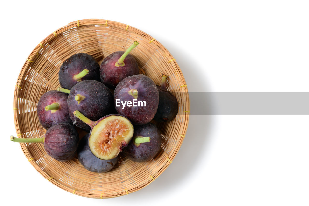 HIGH ANGLE VIEW OF FRUITS IN BASKET ON WHITE BACKGROUND