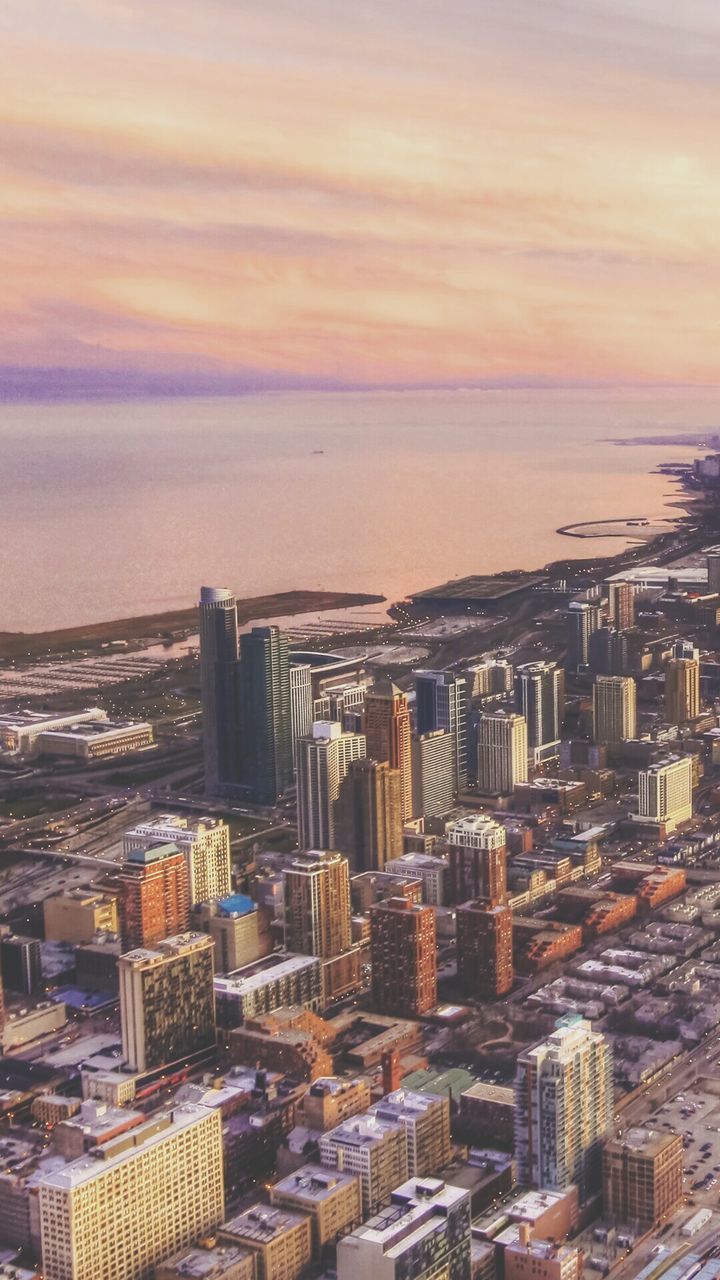 High angle view of city at sunset