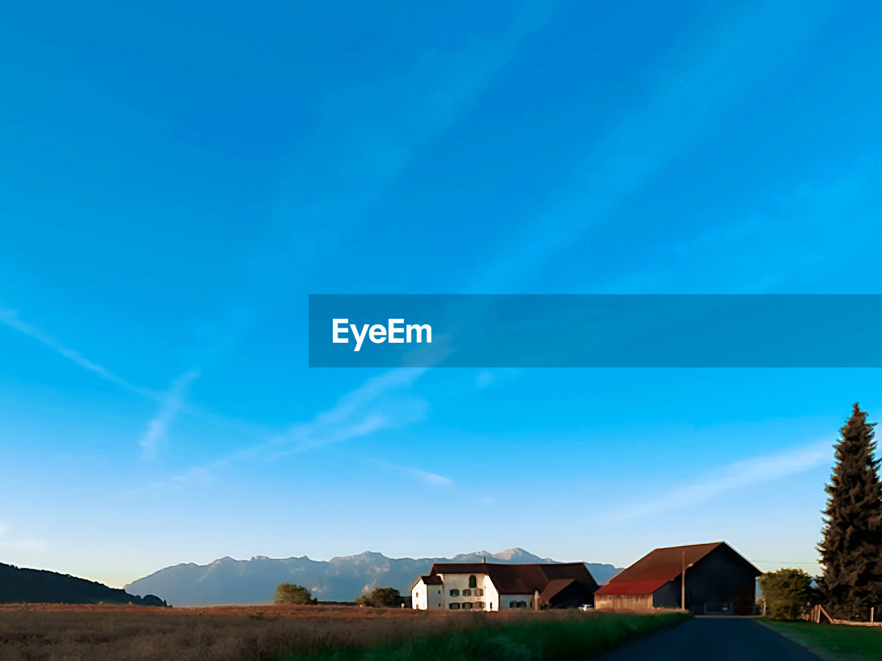 HOUSES AND TREES AGAINST SKY