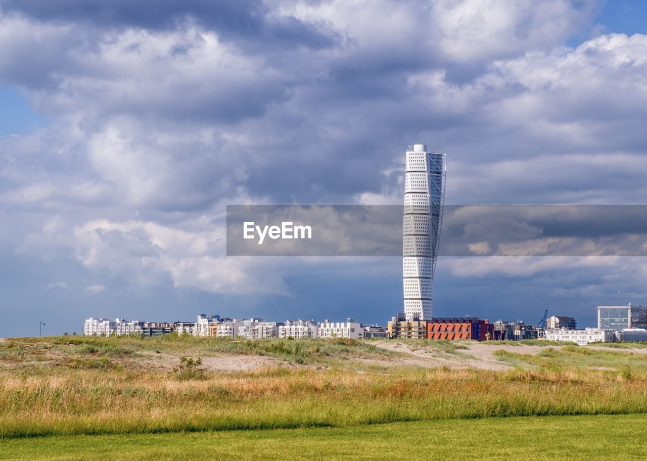 View of famous turning torso skyscraper at malmo by cloudy day, malmo, sweden 