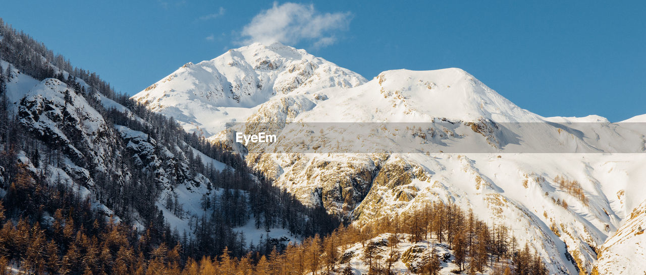 SNOWCAPPED MOUNTAINS AGAINST SKY