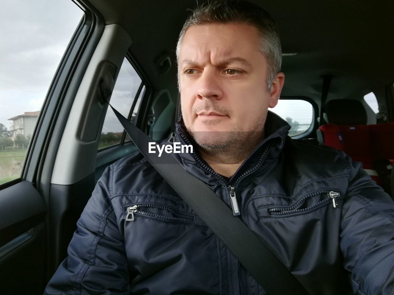 Mature man in car