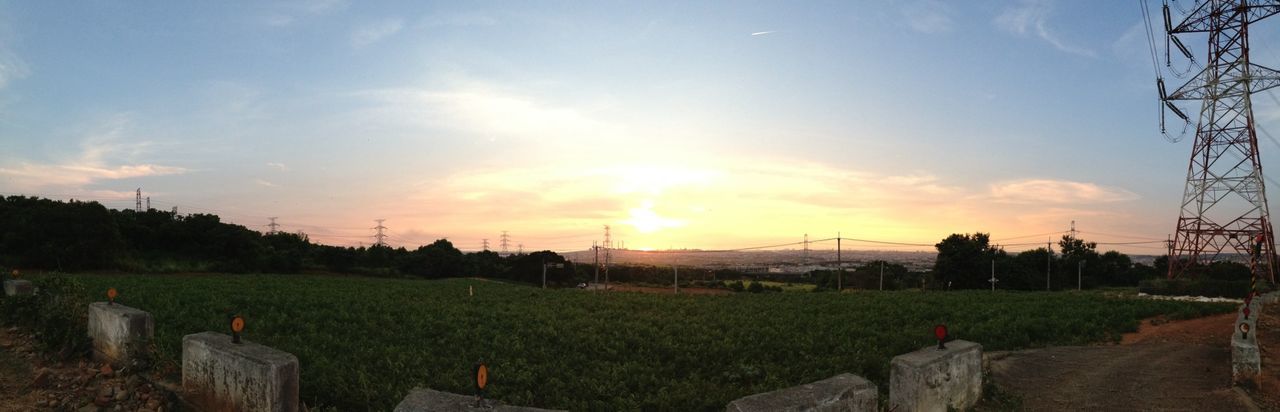 SCENIC VIEW OF FIELD AGAINST SKY AT SUNSET