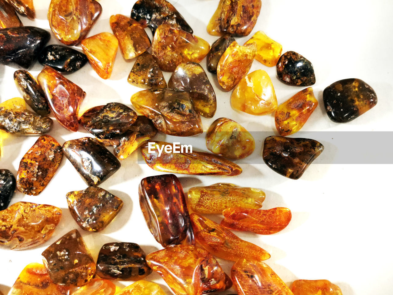 amber, food, food and drink, white background, large group of objects, indoors, still life, dried fruit, no people, produce, healthy eating, freshness, dried food, studio shot, abundance, wellbeing, fruit, close-up, fashion accessory