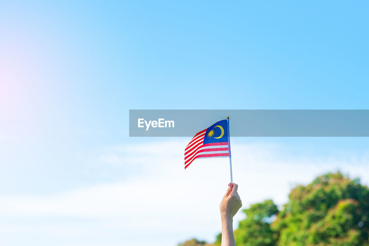 LOW ANGLE VIEW OF FLAG AGAINST SKY