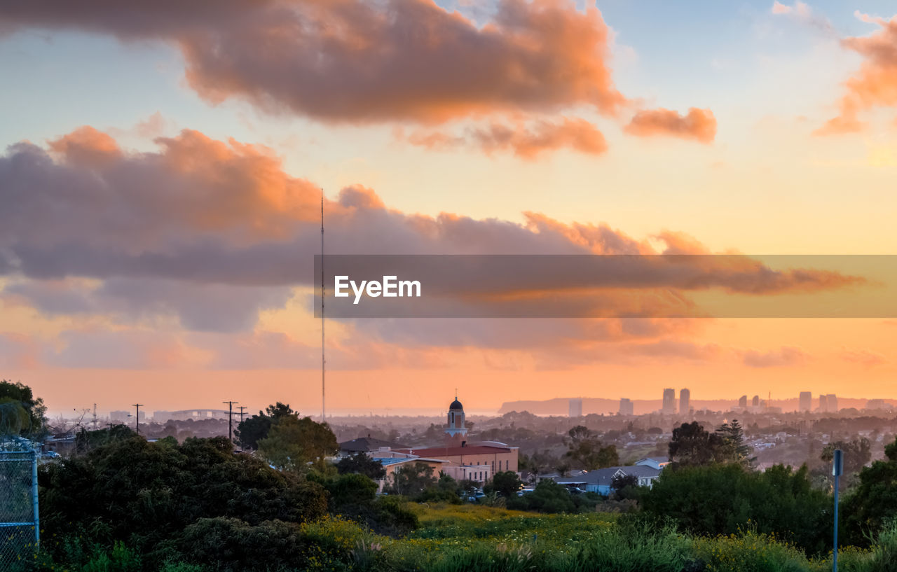 CITYSCAPE AGAINST SKY DURING SUNSET